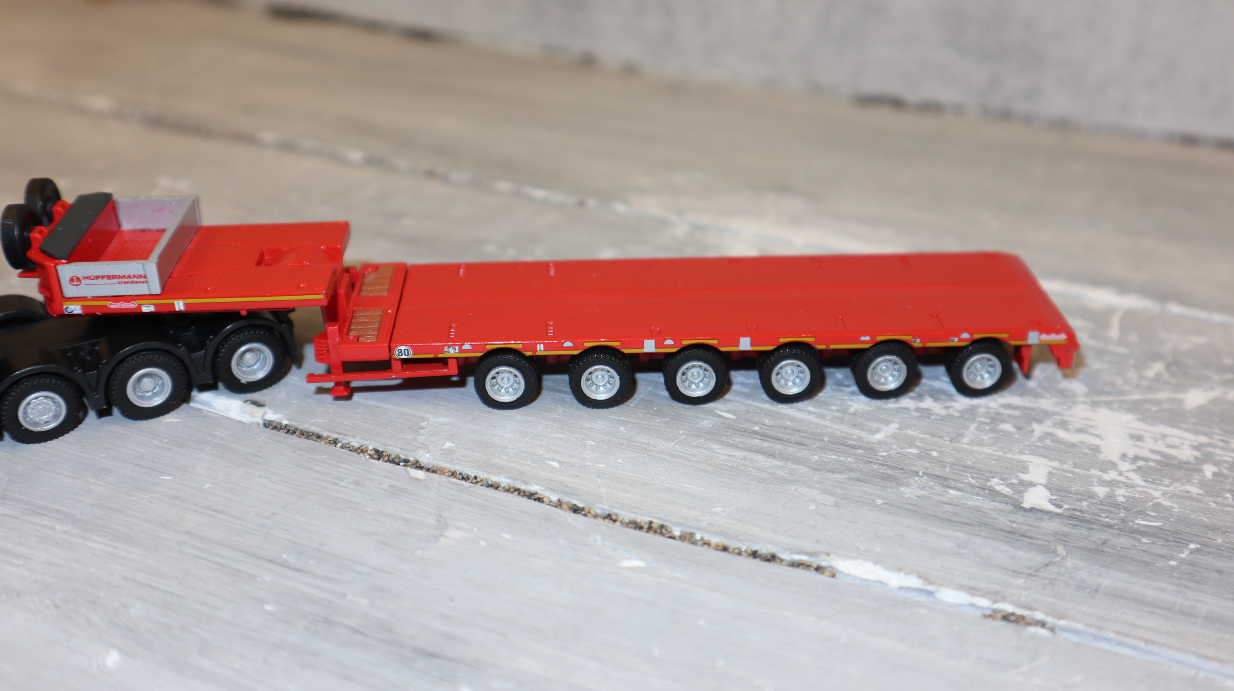 TEMA WSI 72-2062 in 1:87, Werbemodell Hüffermann 4-Achser mit 6-Achser Tiefbett, Neu in OVP